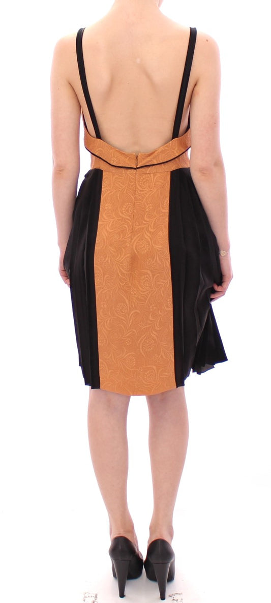 Backless dress with black straps and orange patterned skirt