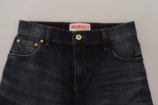 Pair of blue jeans with gold buttons on waistband