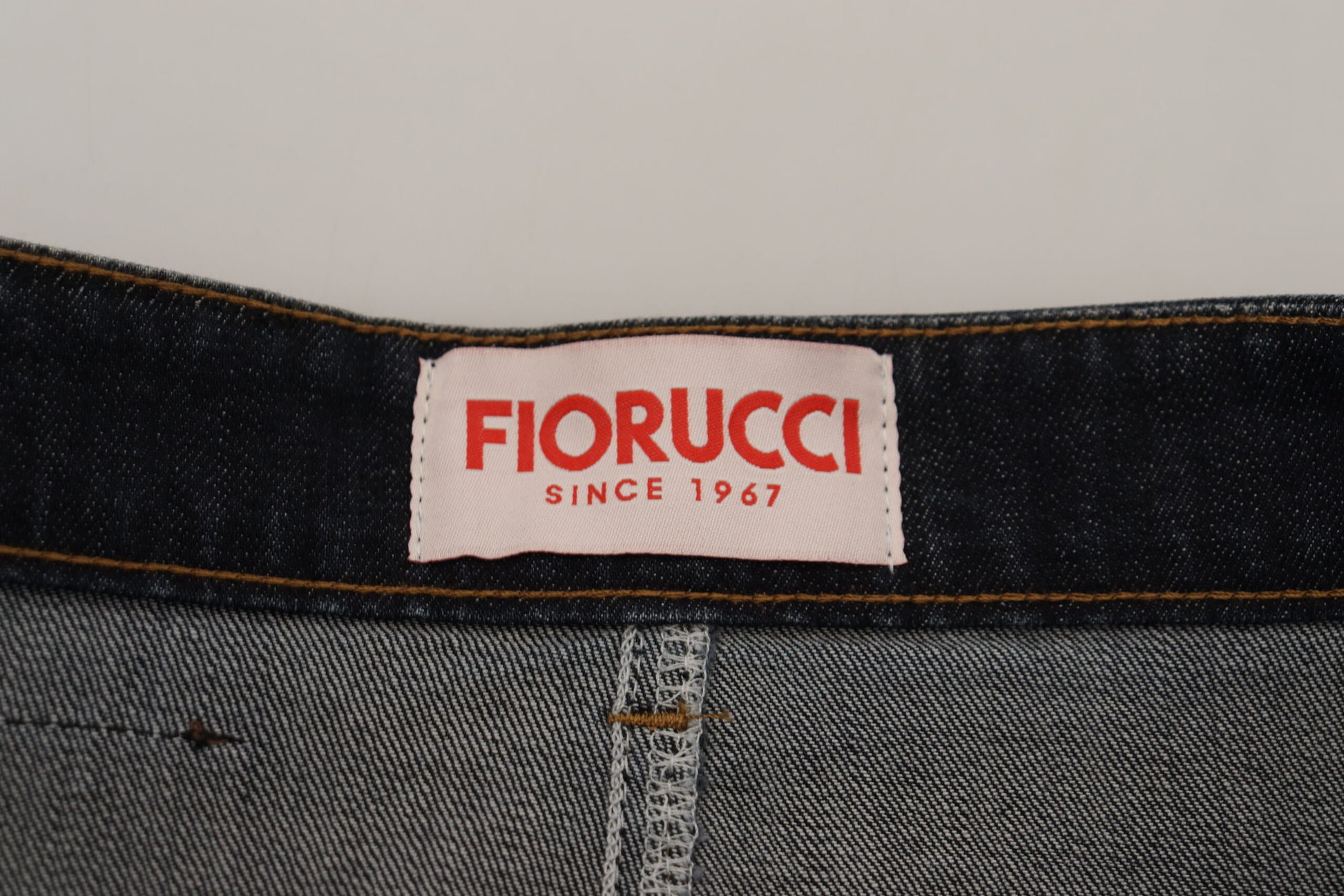 Blue denim jeans with red label on waistband
