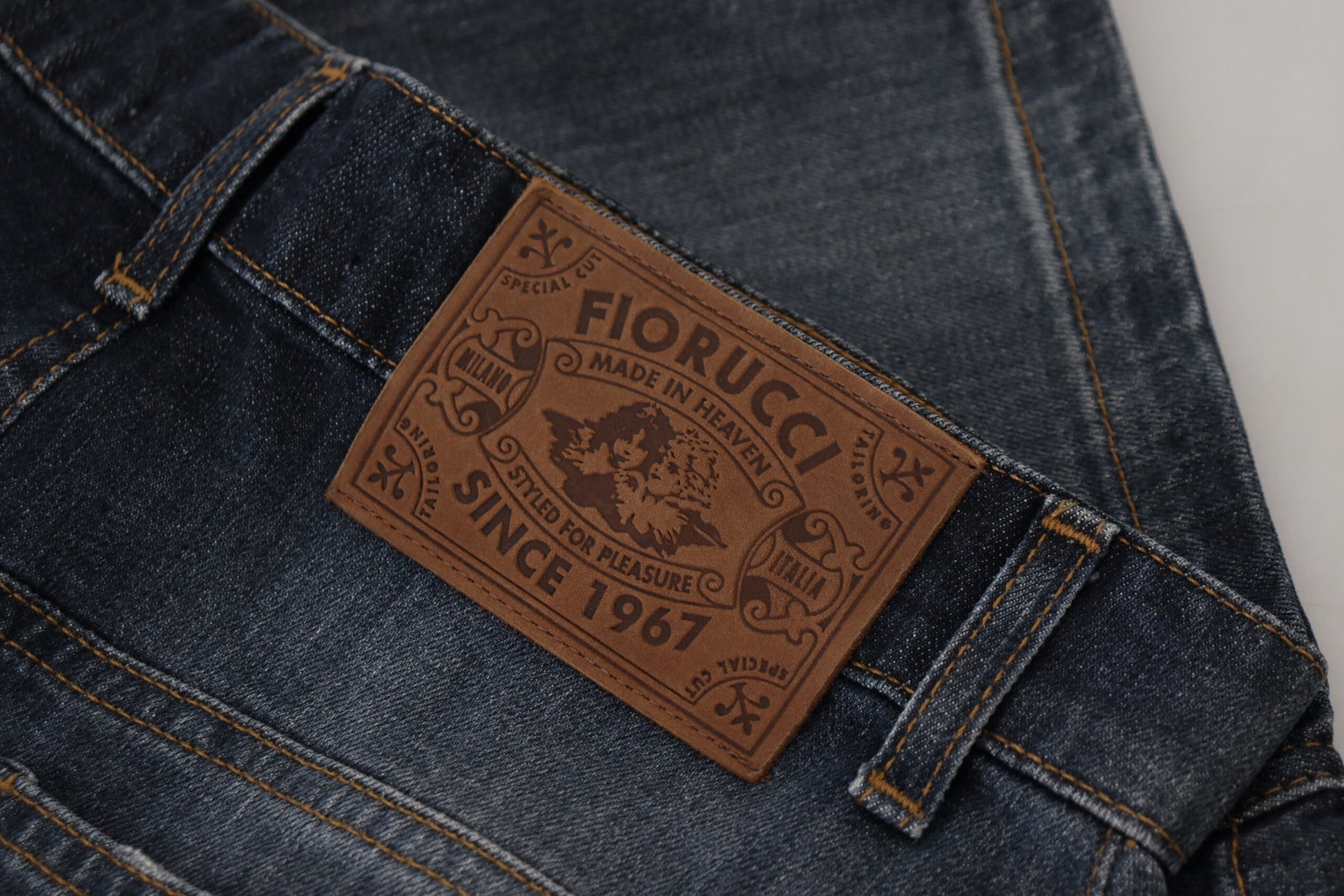 Pair of blue jeans with brown leather label on waistband