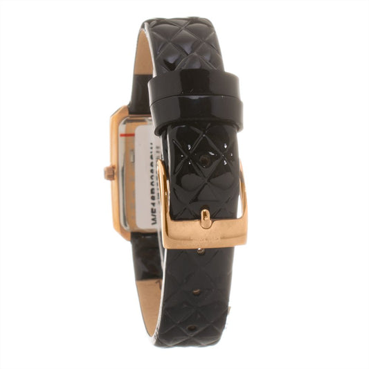 A black leather watch with gold accents