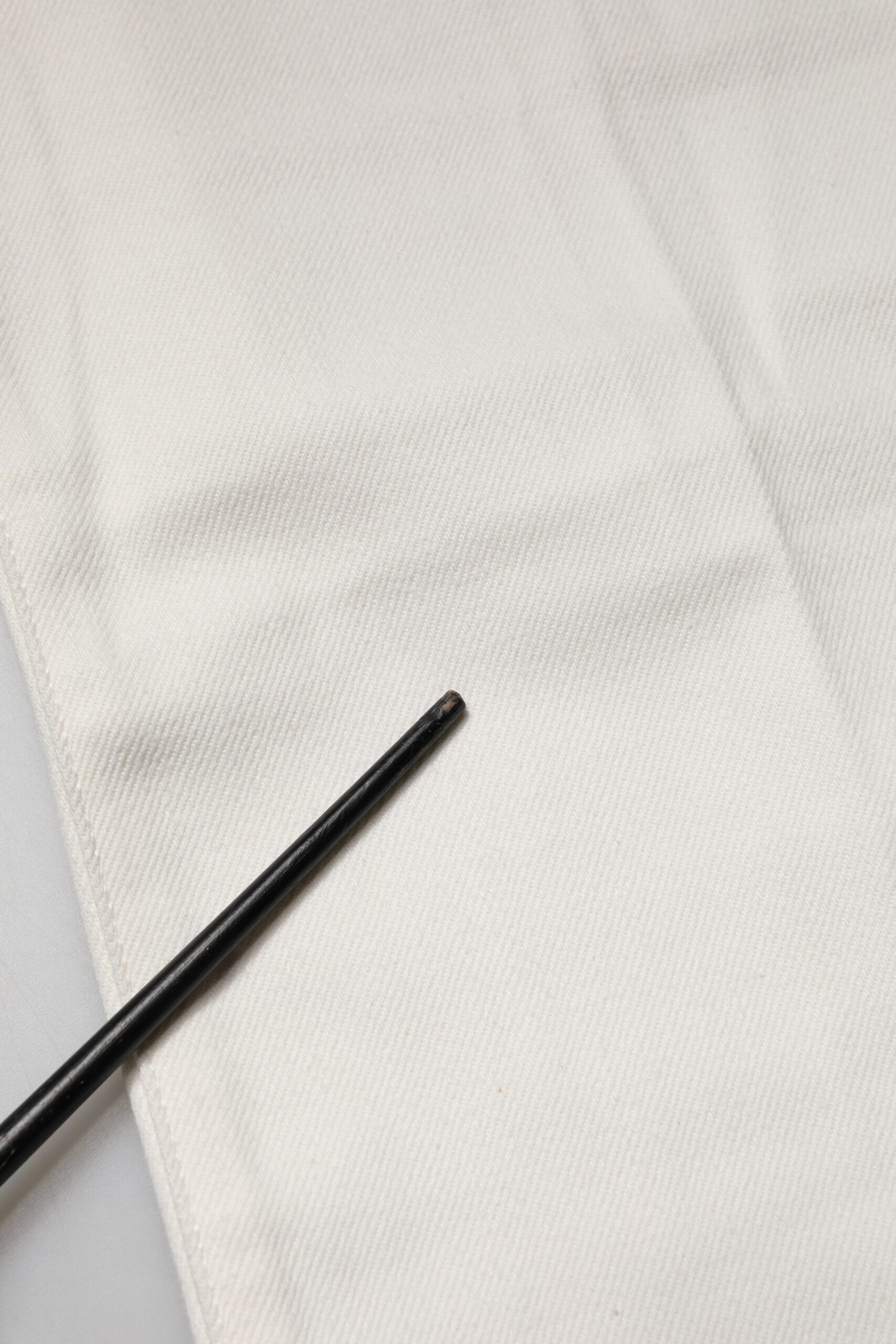Black chopsticks on white cloth