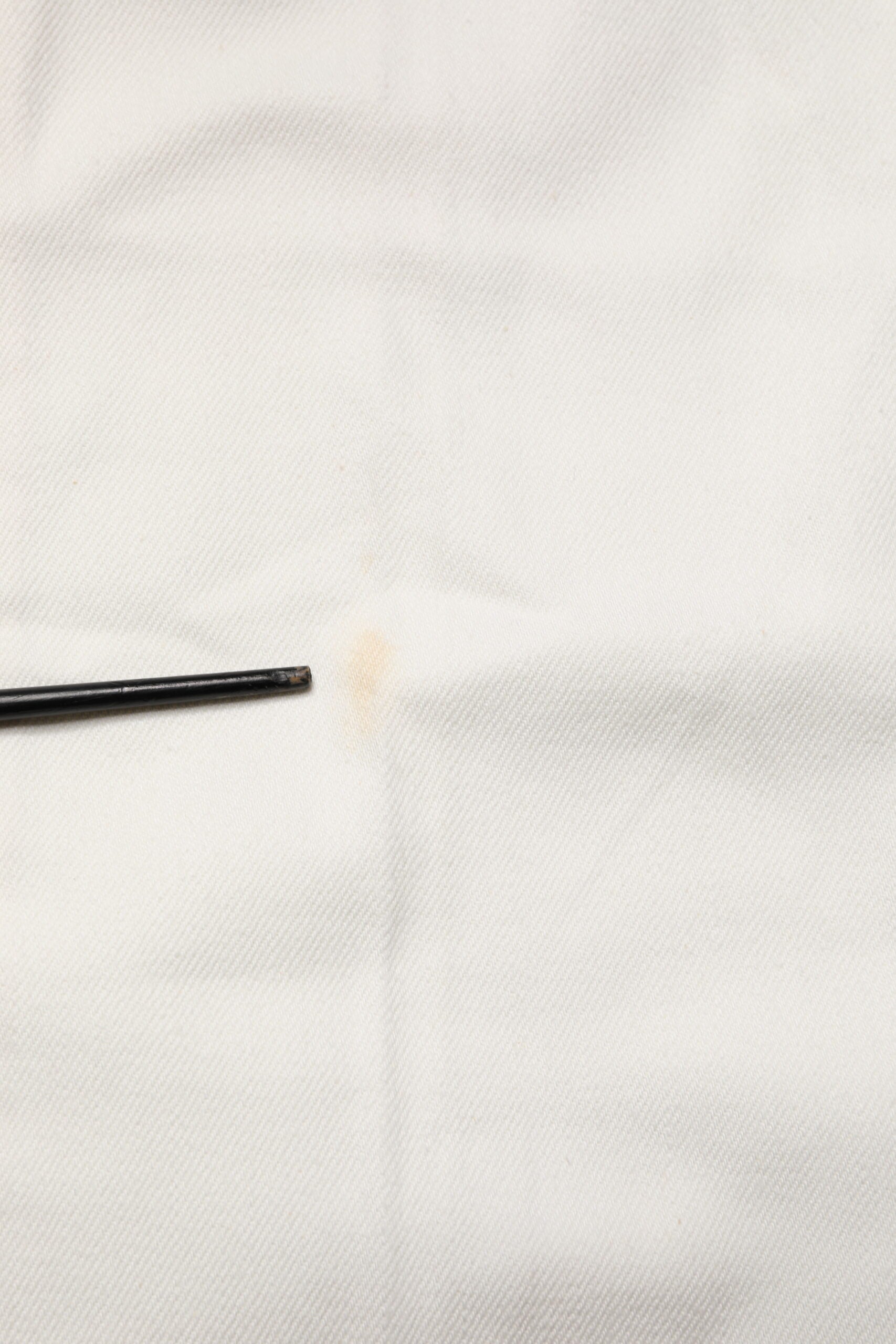 Black pen on white cloth