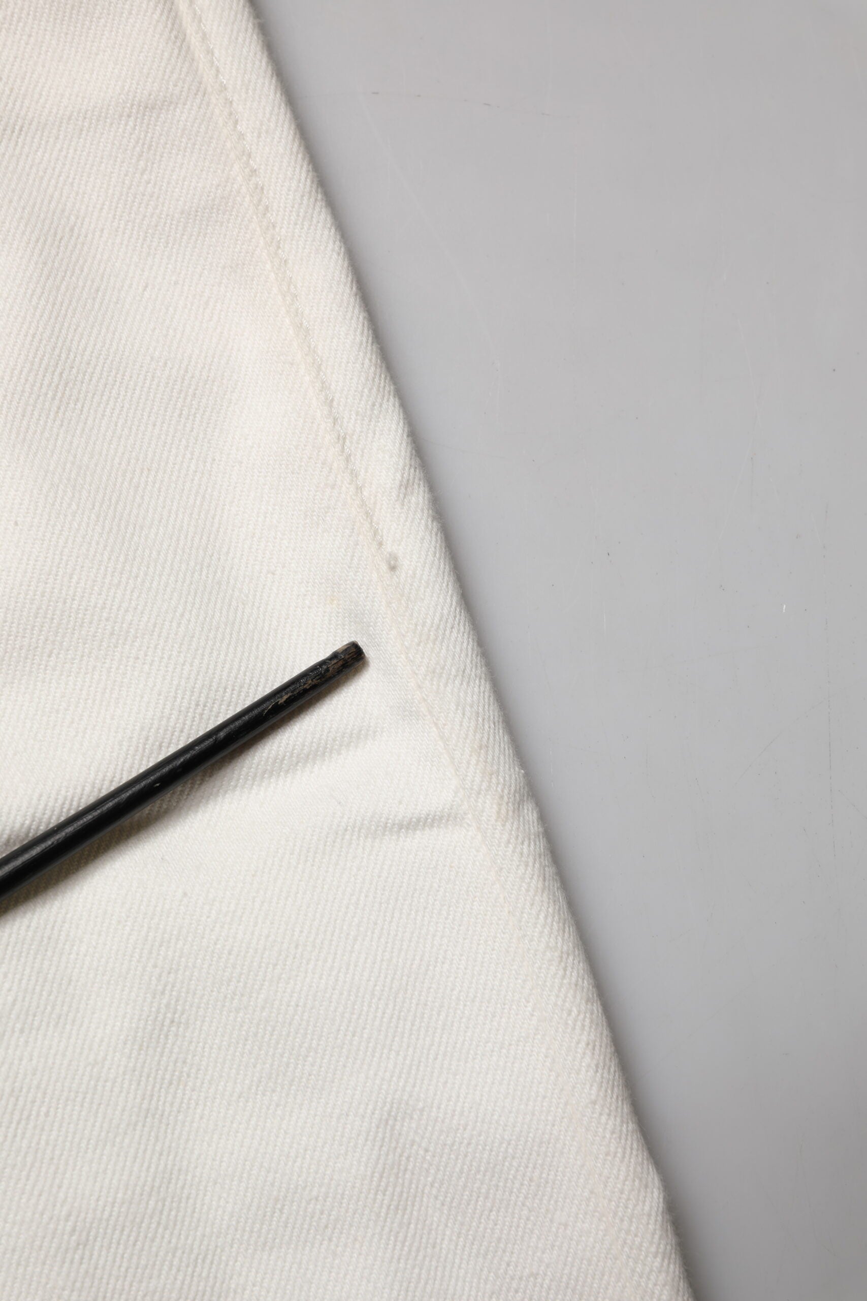 Black pen on white cloth