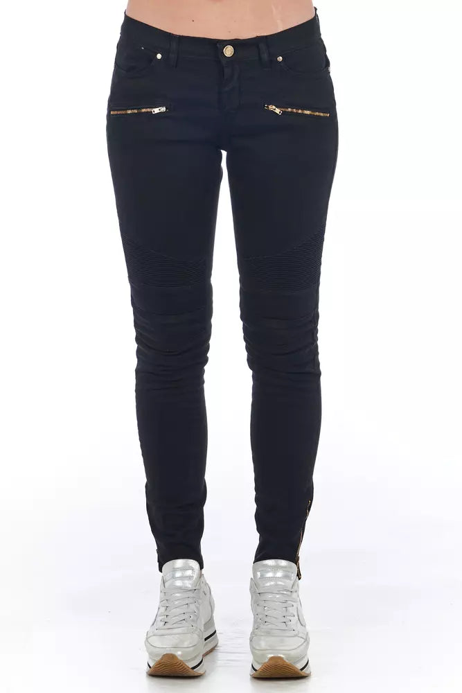 Pair of black skinny jeans with gold zippers