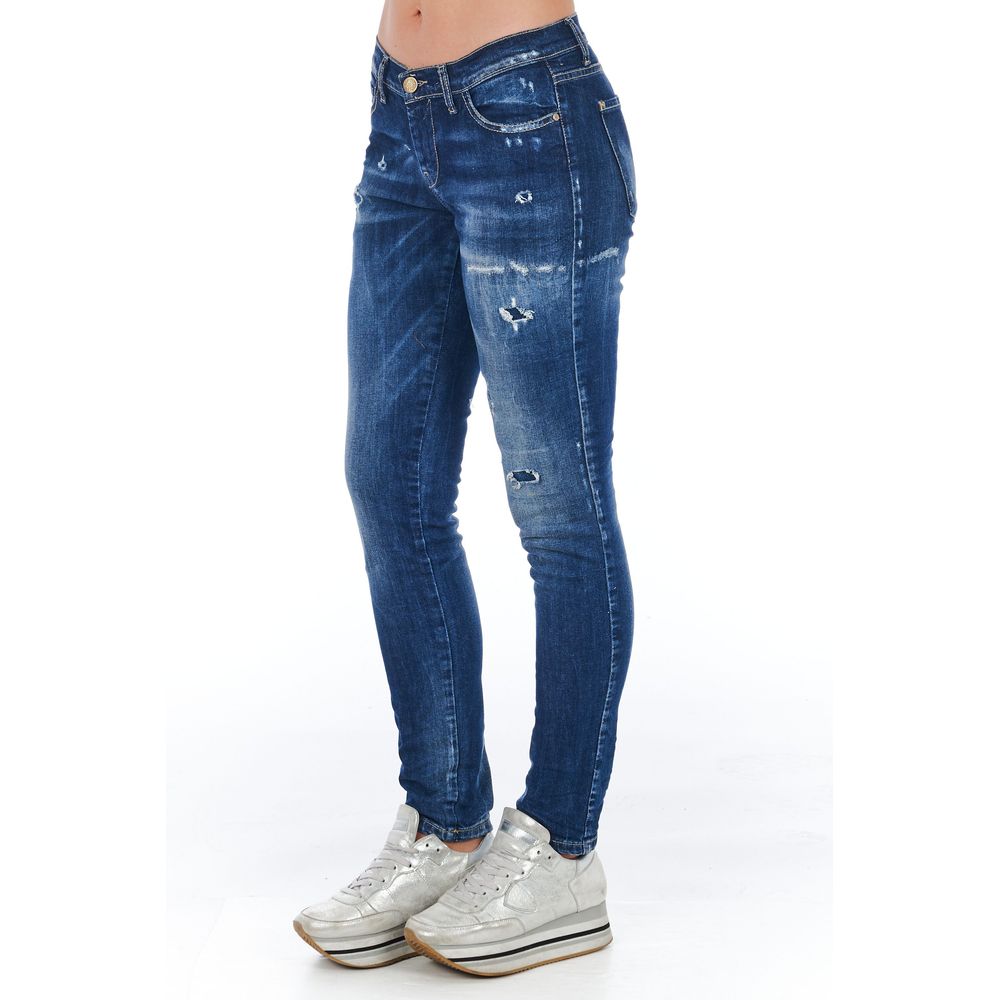 Woman wearing blue jeans and white sneakers