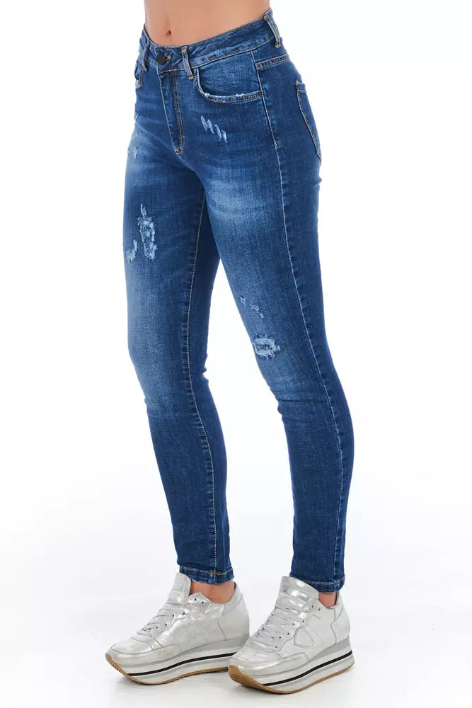 Blue denim jeans with distressed areas on legs