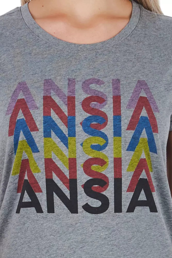 The shirt has a colorful graphic design on the front