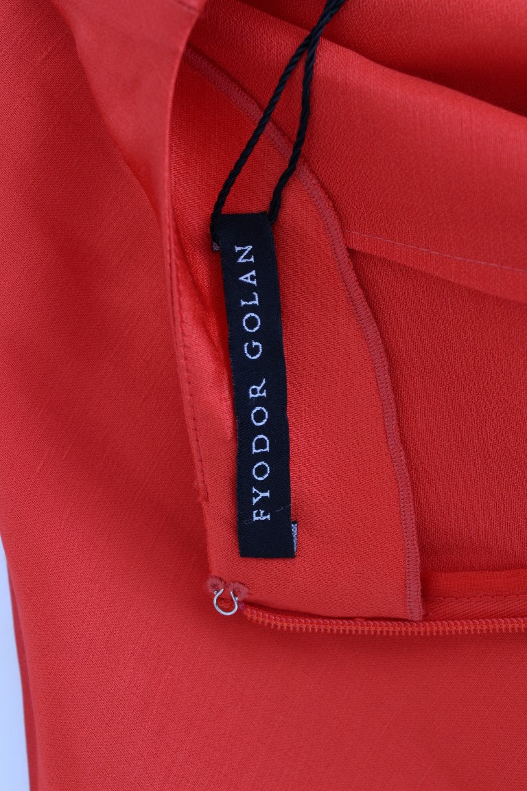 Red fabric with tag attached to it