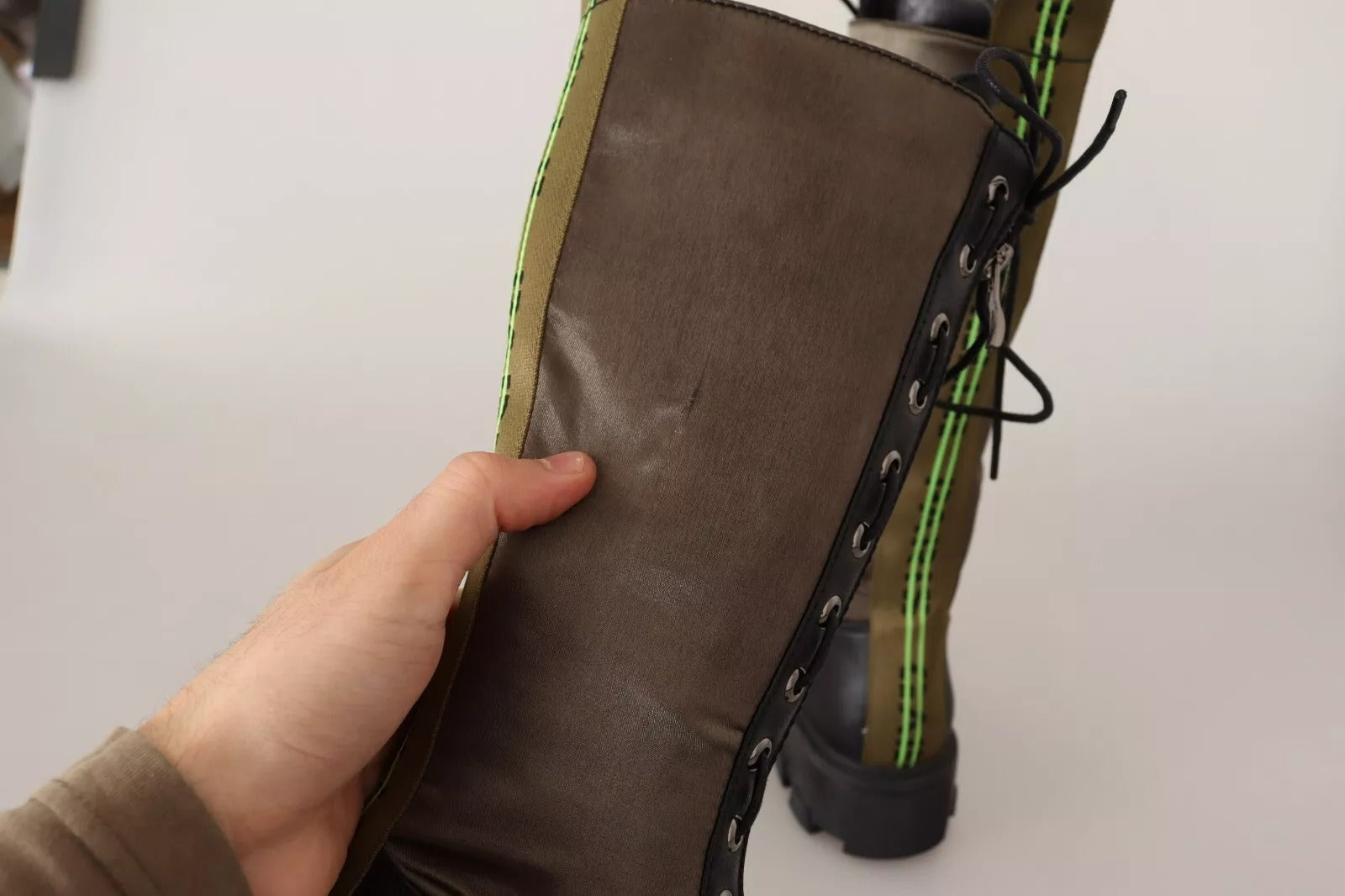 Brown boot with green laces