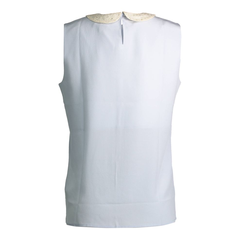 White sleeveless vest with gold trim