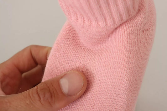 Pink sock on hand