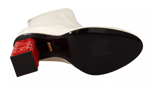 Black and white shoe with red heel
