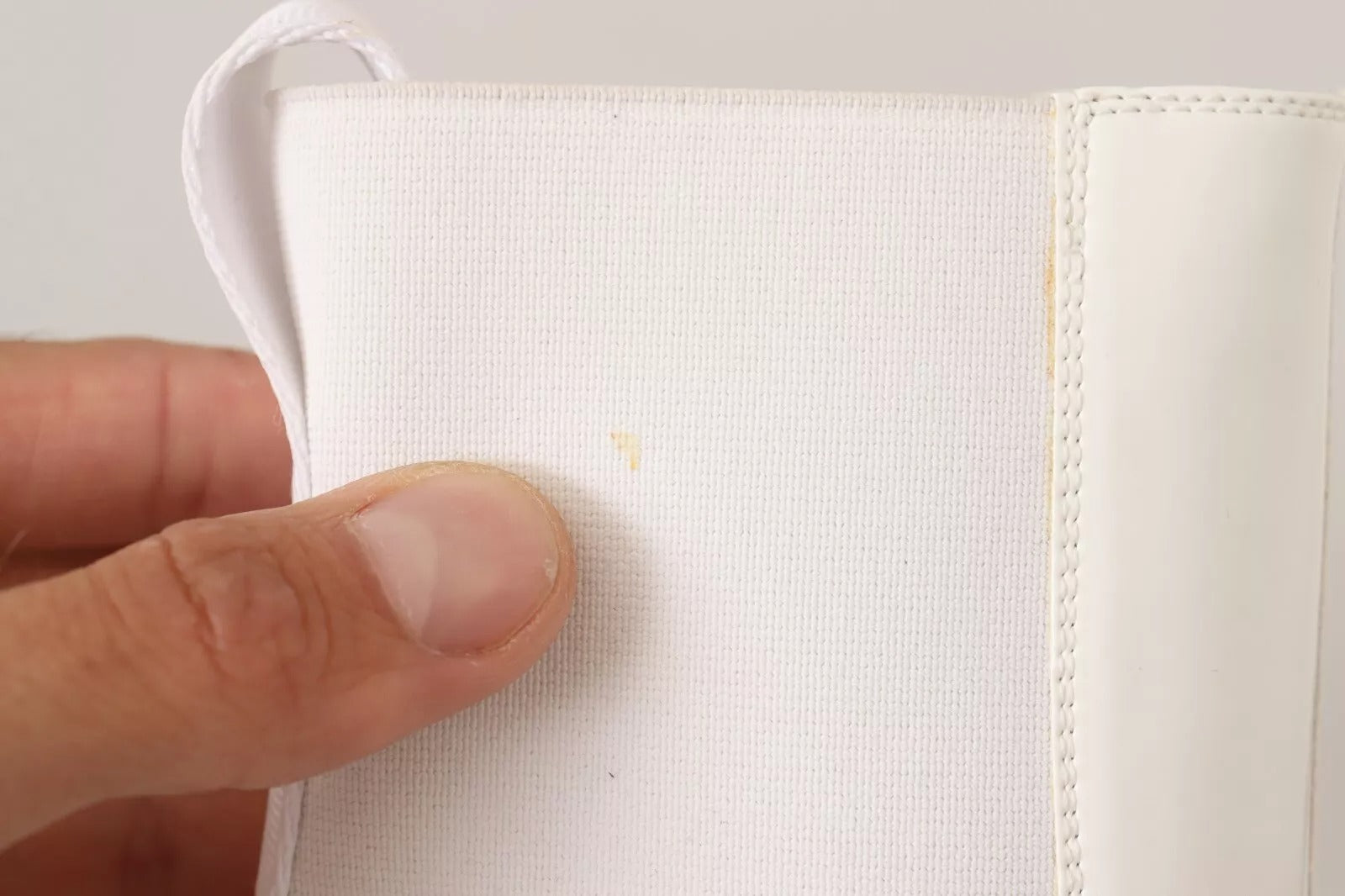 White cloth napkin in hand