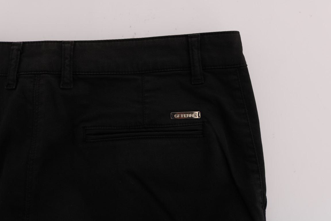 Pair of black jeans with a gold zipper pull