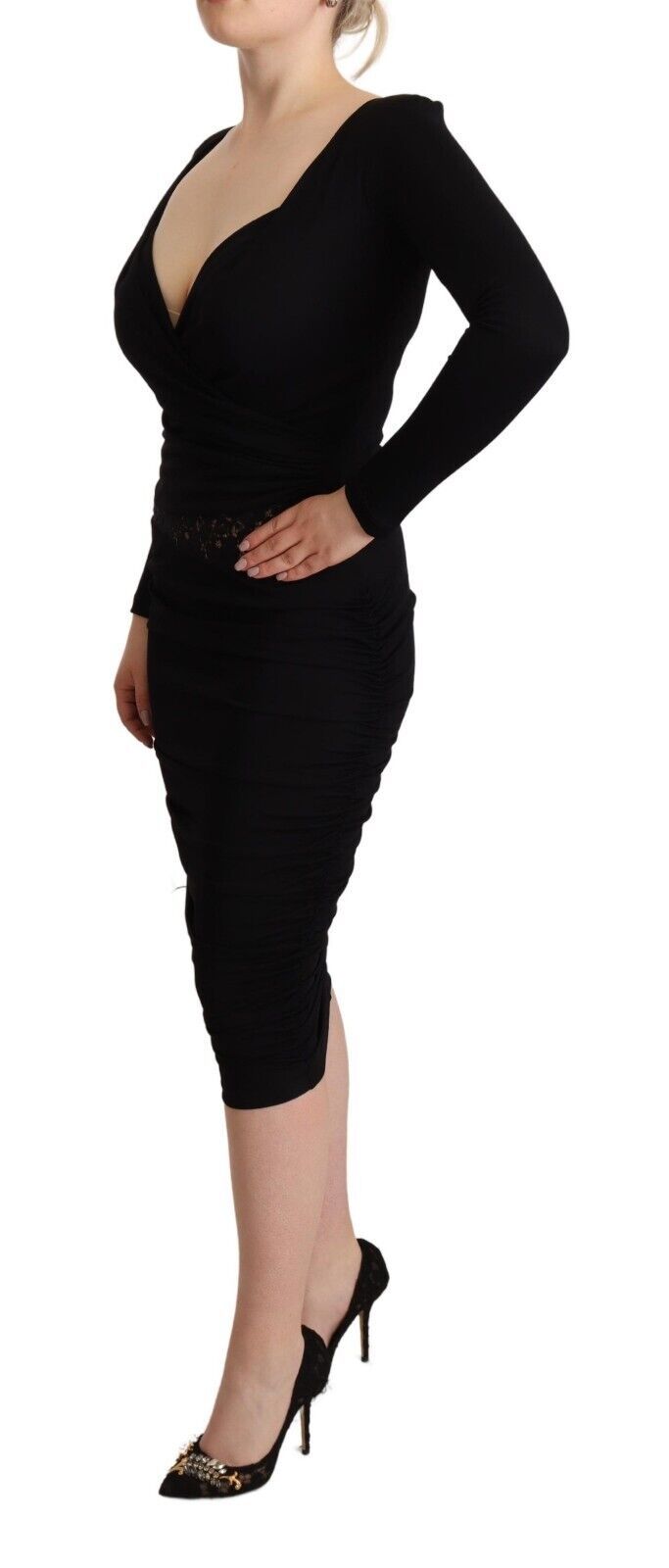 A black long sleeve dress with a sweetheart neckline and midi length