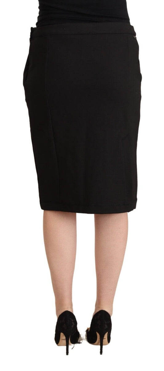Black skirt worn by a woman standing against a white background