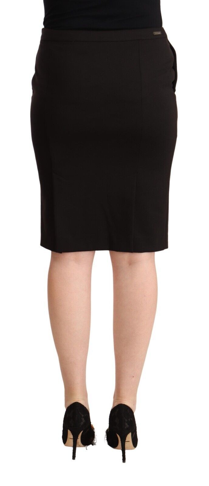 Woman wearing black skirt and black heels