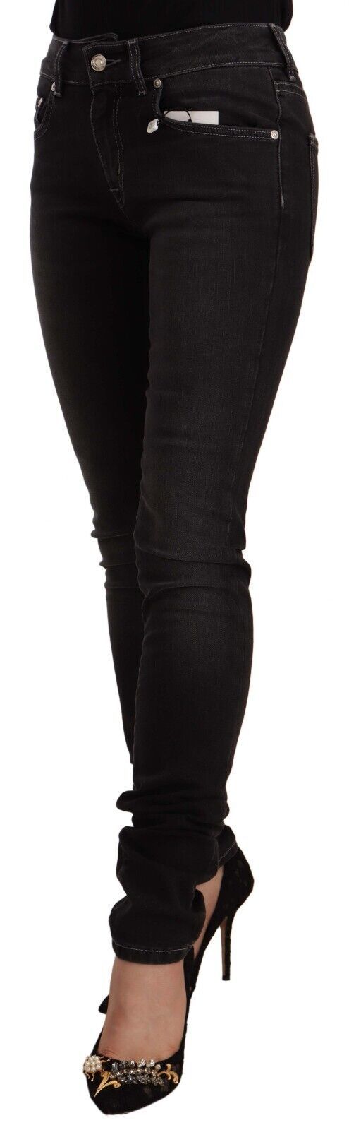 Pair of black skinny jeans with distressed detailing