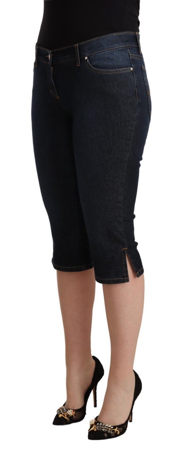 Woman wearing jean shorts and black heels