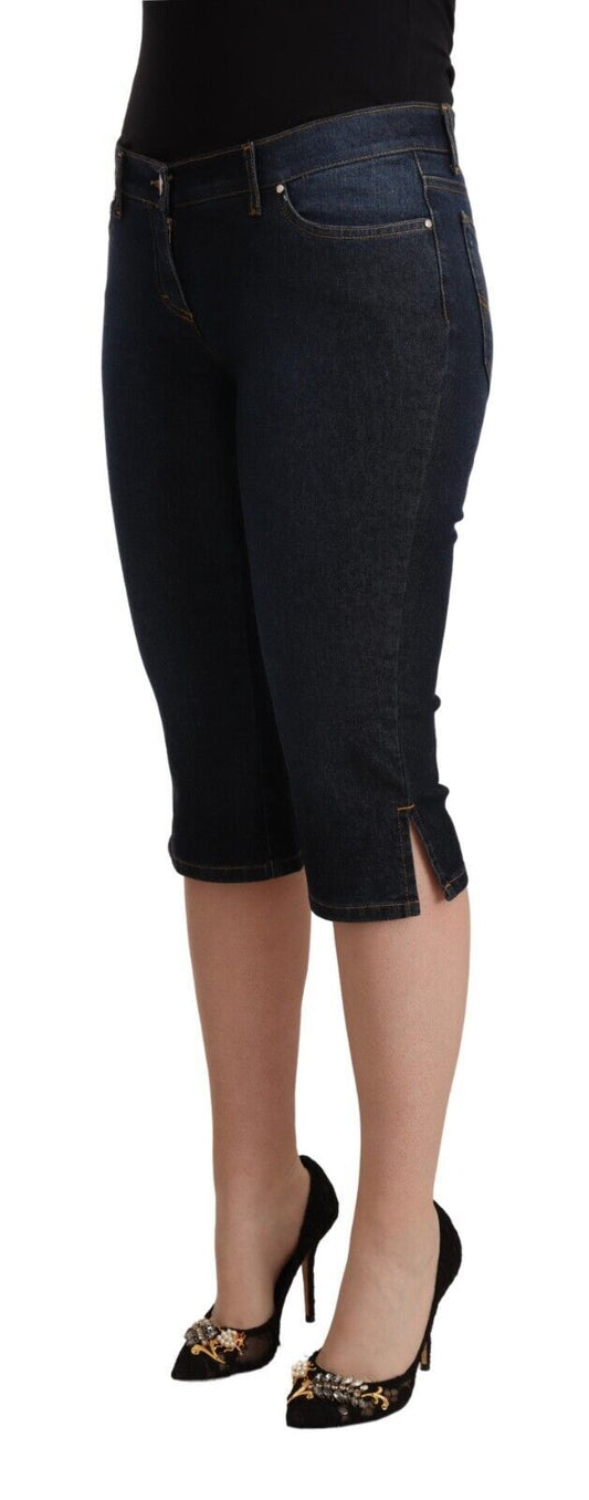 Woman wearing jean shorts and black heels
