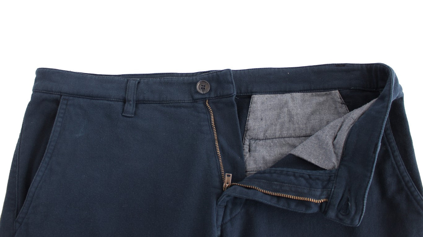 Pair of blue jeans with a hole in the knee