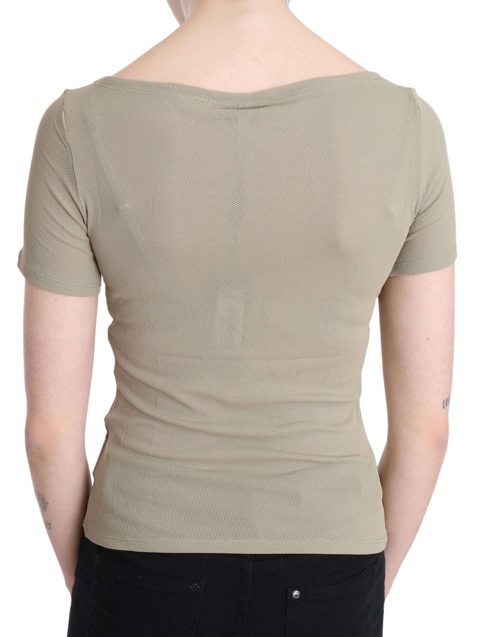 Tan knit top on back of person