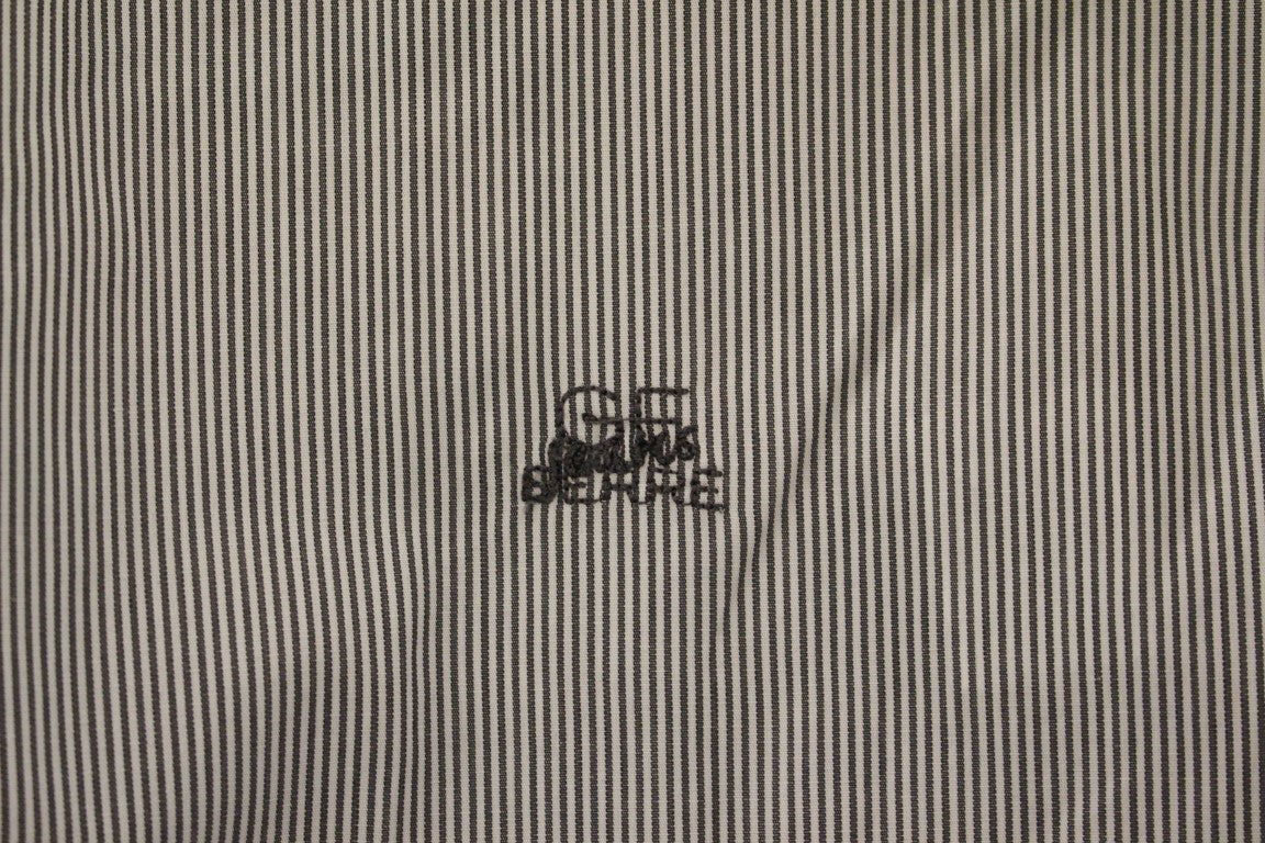Black and white fabric with a small embroidered logo