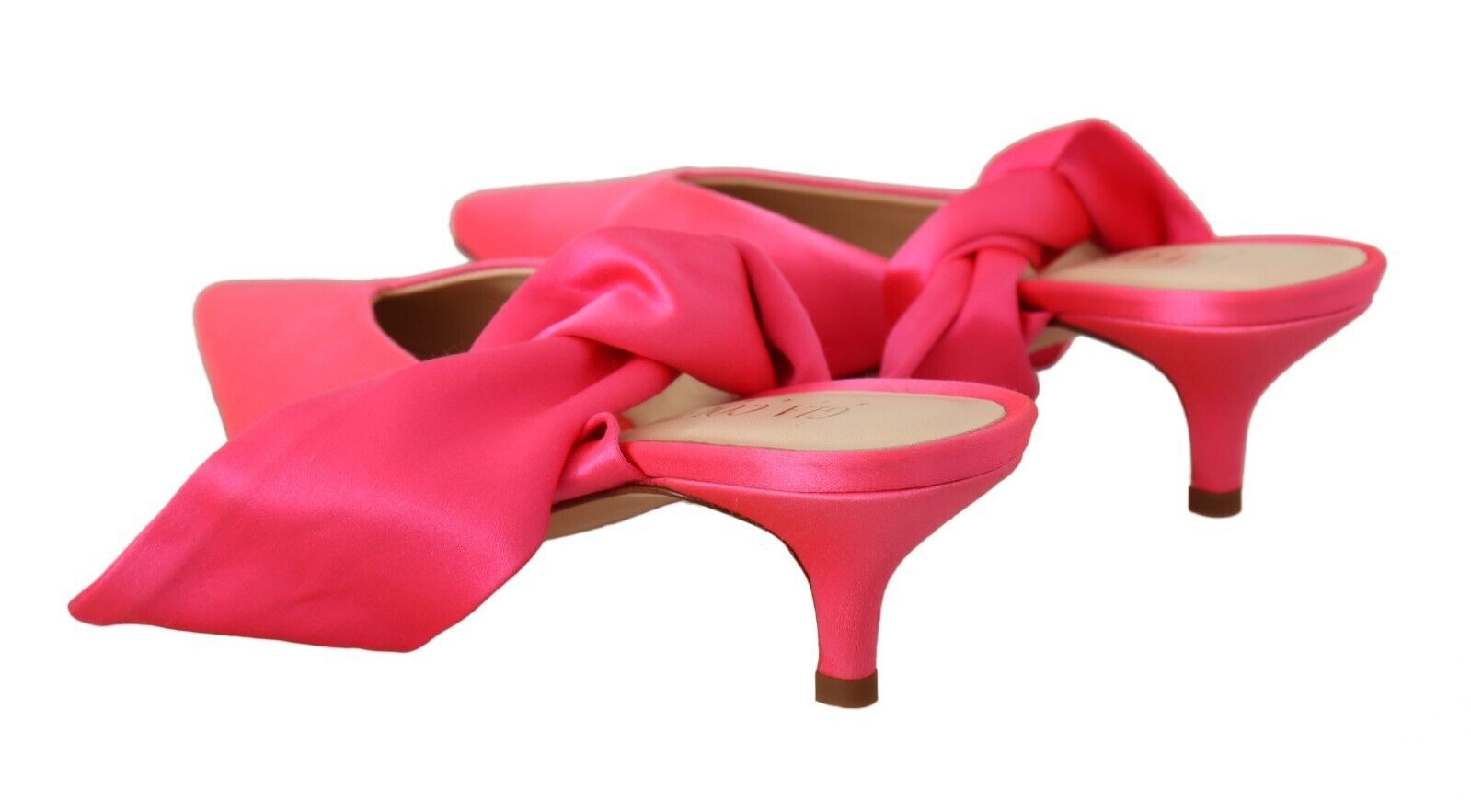 Pair of red high heel shoes with ribbon detailing