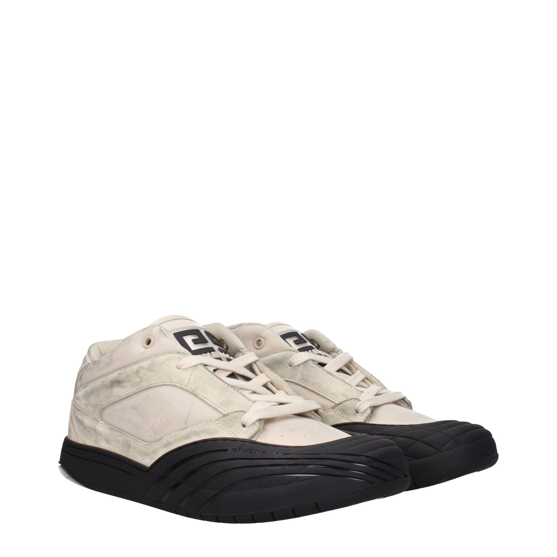 Pair of beige chunky sneakers with black soles, laces and logo