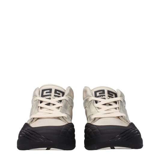 Pair of beige chunky sneakers with white laces, featuring a textured fabric upper and black soles
