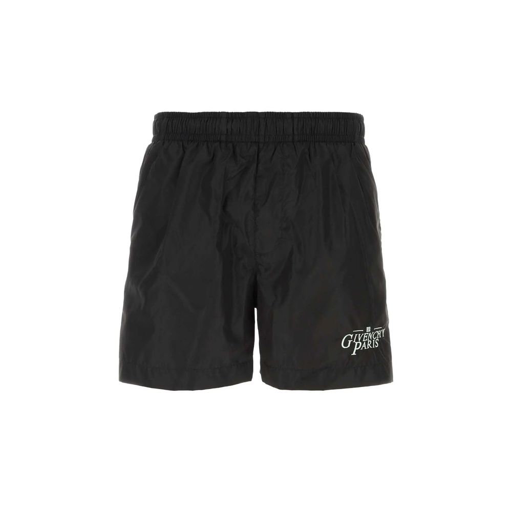 Black athletic shorts with white logo on left leg