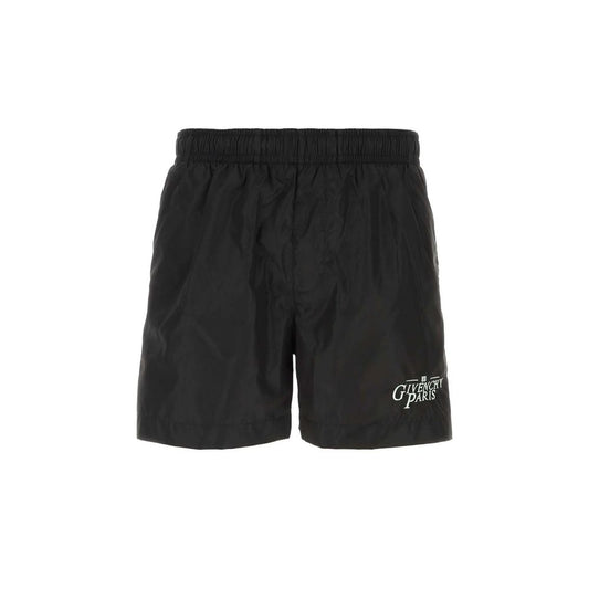 Black athletic shorts with white logo on left leg