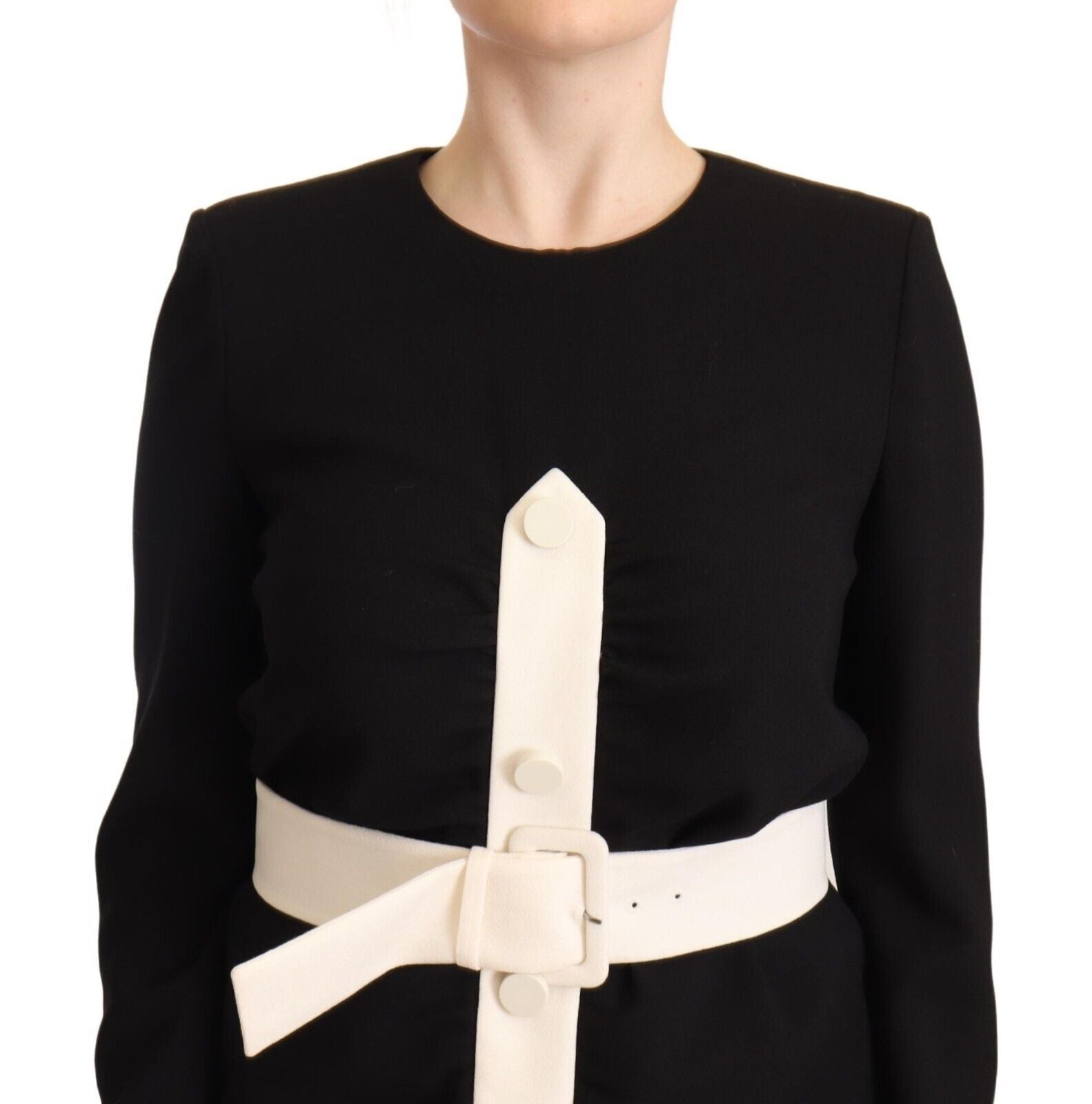 A black wool belted mini sheath dress with long sleeves