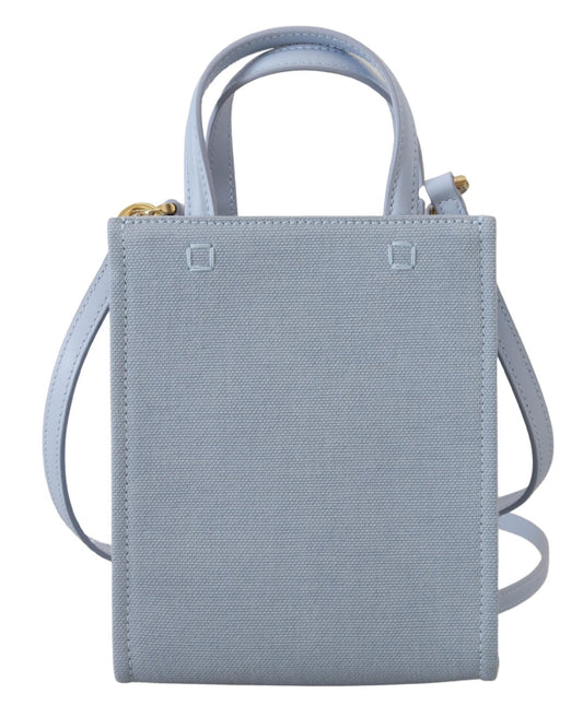 Blue tote bag with handles and a zippered pocket on front