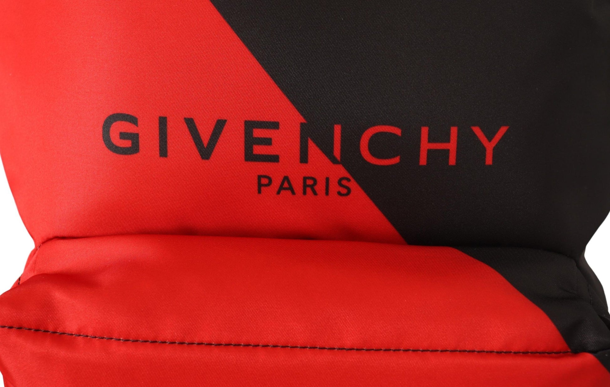 Red and black backpack with white logo