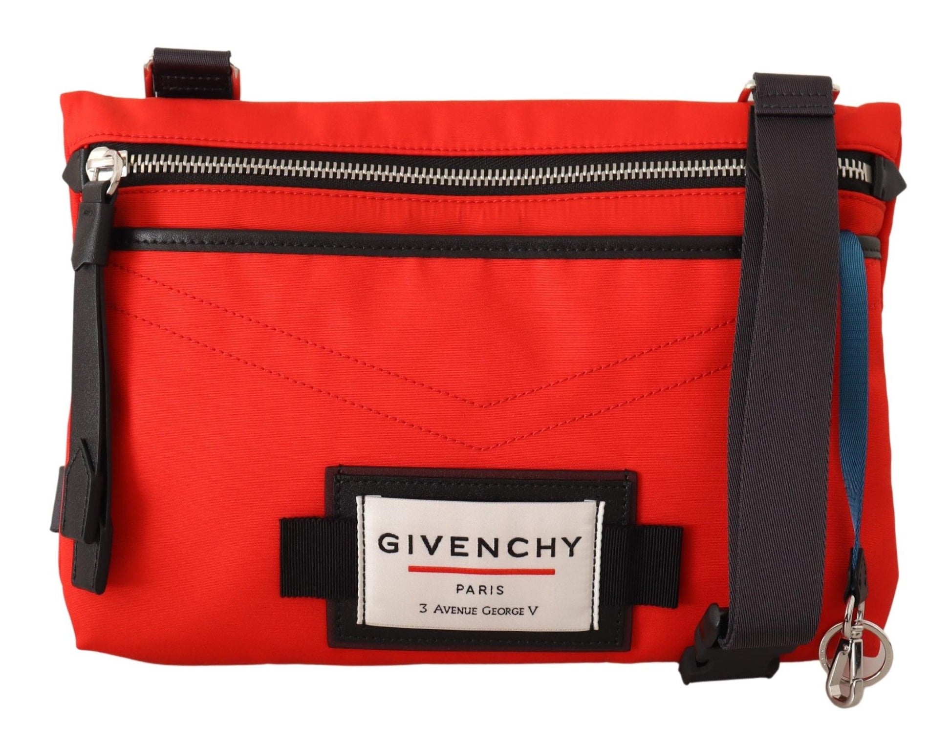Red bag with black straps and a white label on front