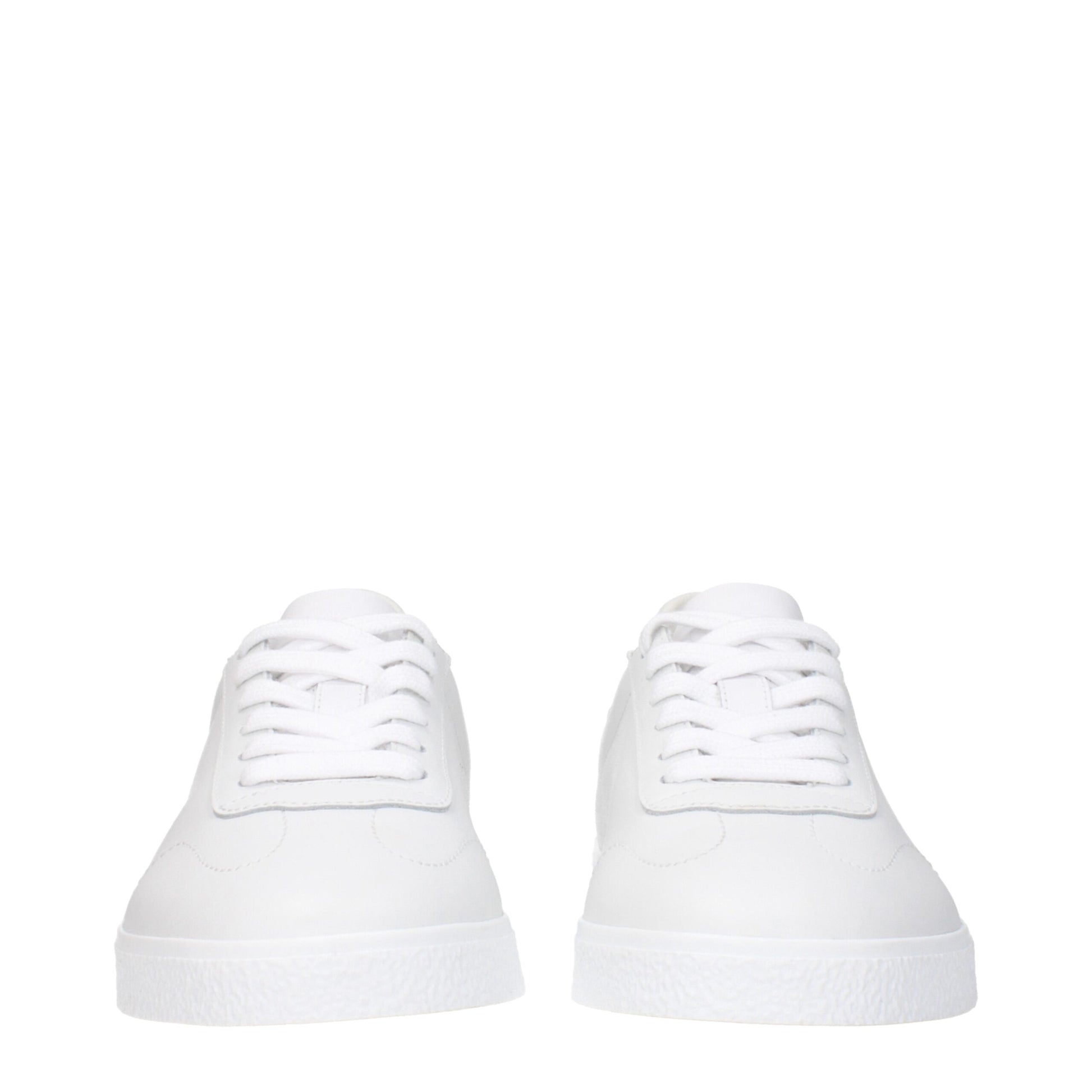Pair of white leather low top sneakers with laces