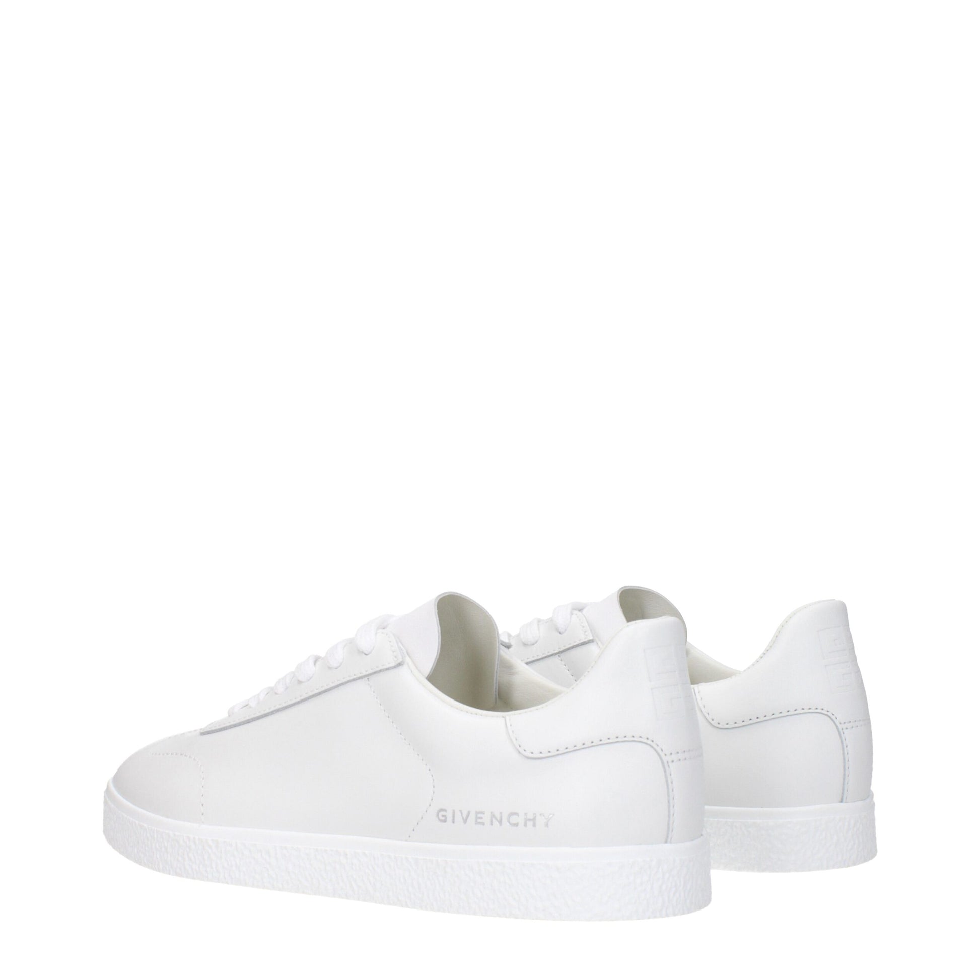 Pair of white leather low top sneakers with black laces, featuring brand name on side and back