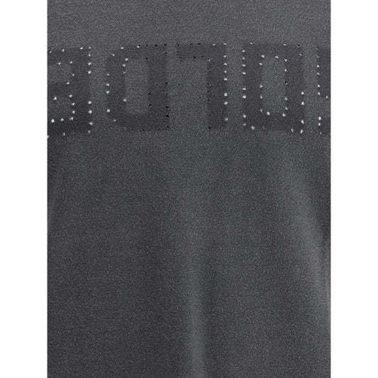 A close-up view of a garment with embroidered text