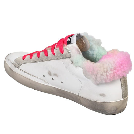 "Golden Goose white leather sneakers with gold buckle and distressed details"