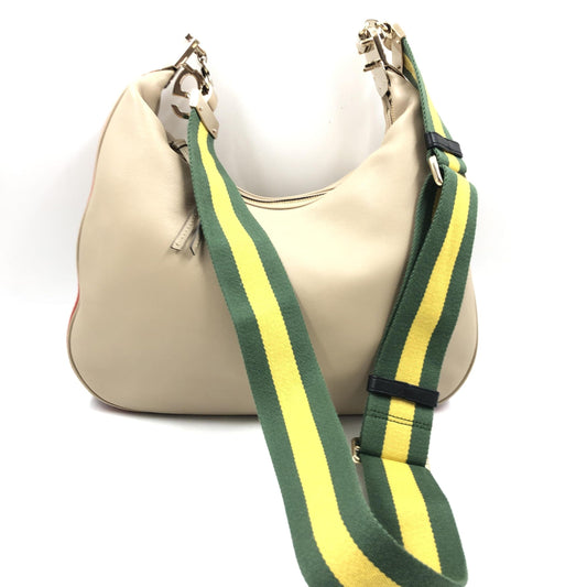 Yellow and green striped strap on a beige purse