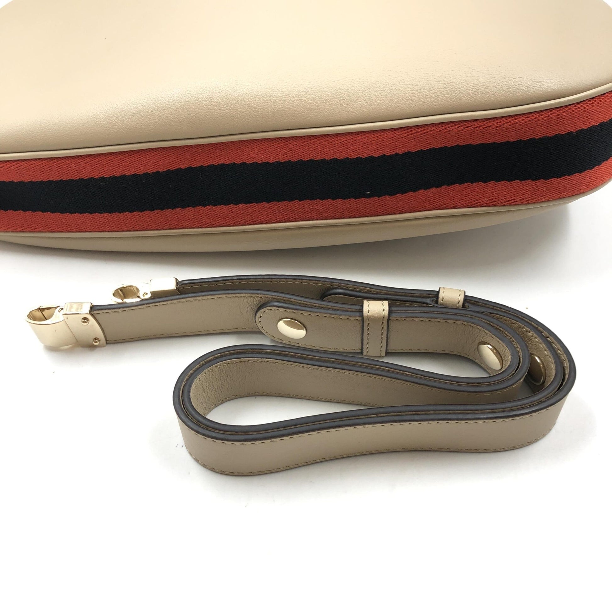 Brown leather crossbody bag with red stripe