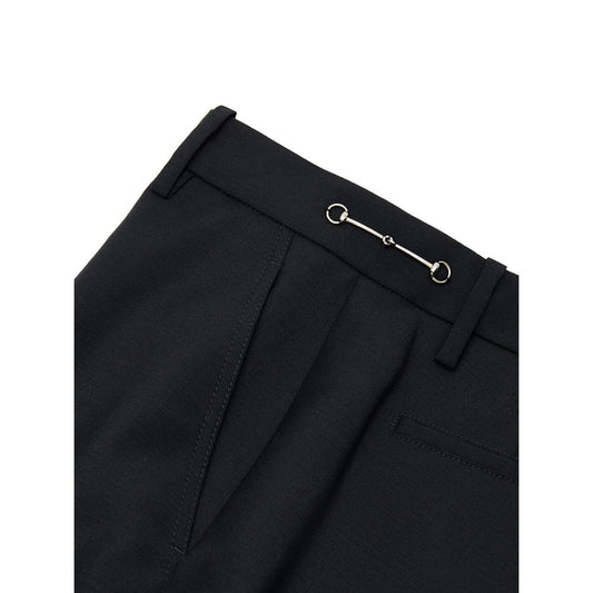 A pair of black wool dress pants with a silver button closure