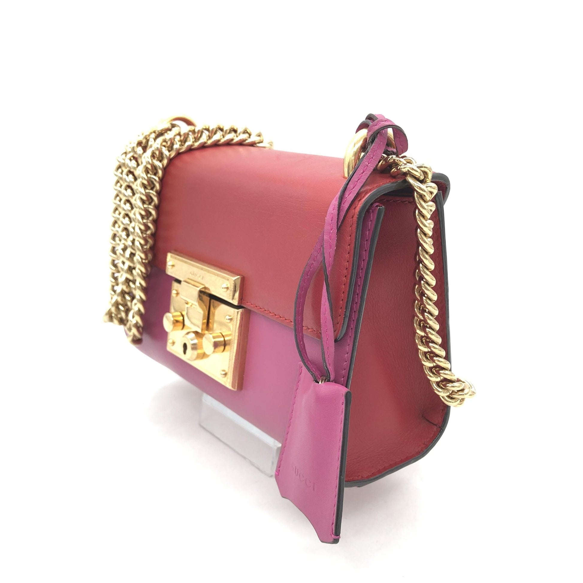 Red clutch purse with gold chain strap