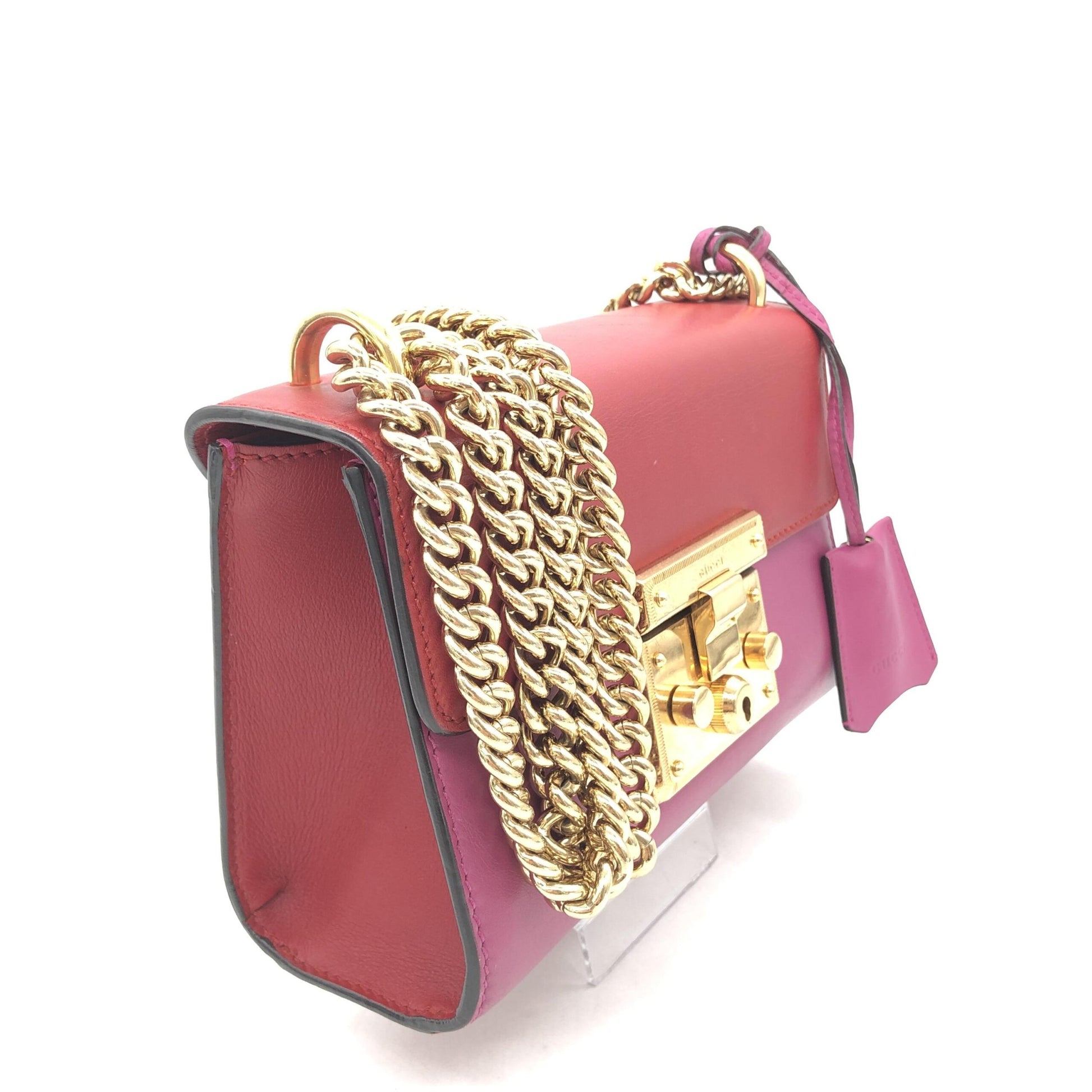 Red clutch purse with gold chain strap