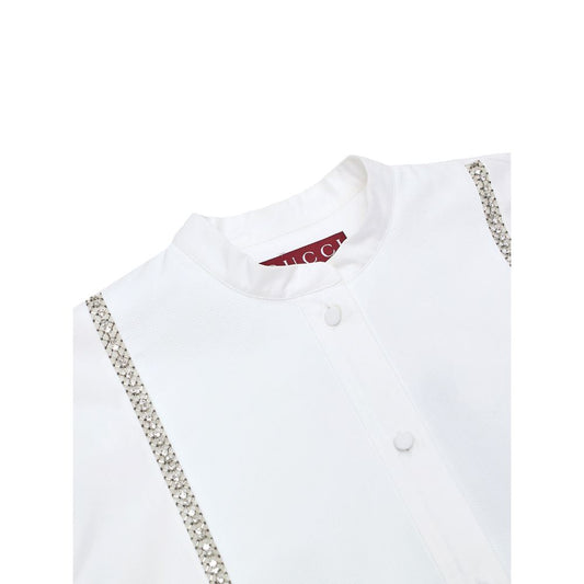 White shirt with embroidered detailing on collar and sleeves