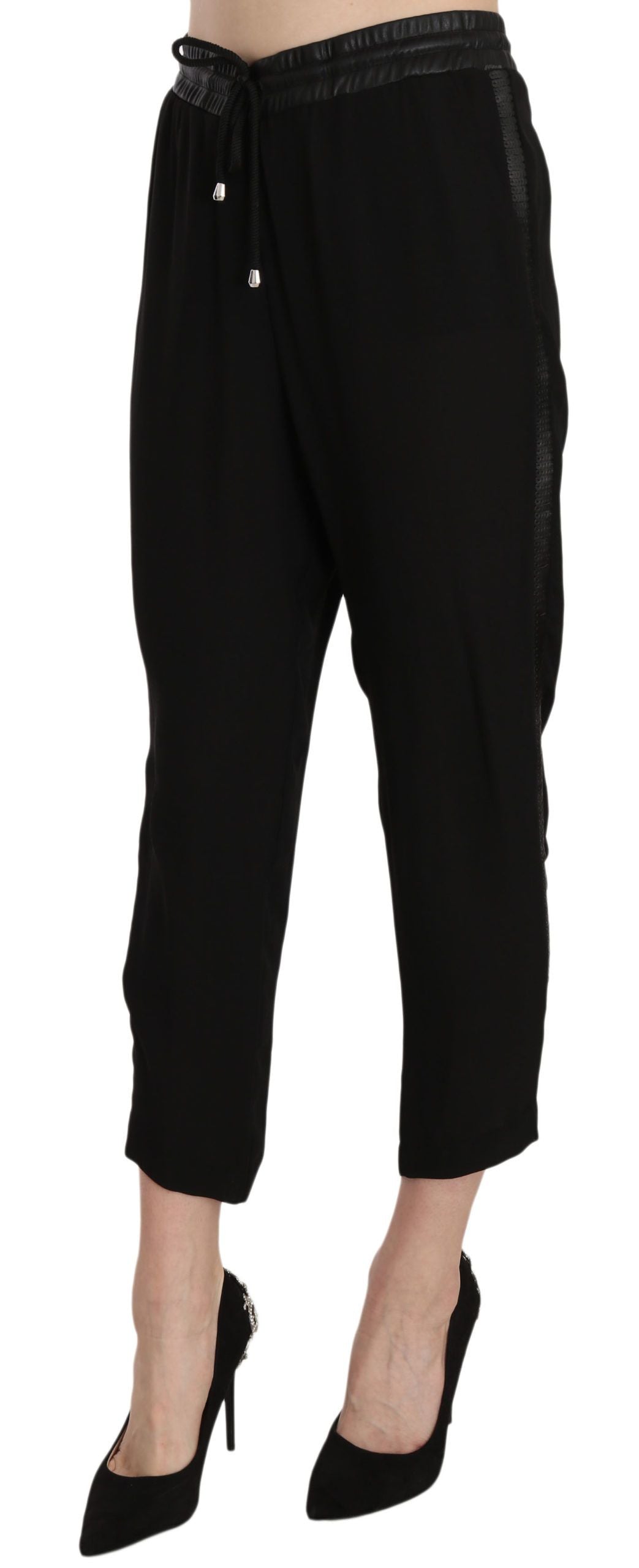 Pair of black pants with rolled up legs