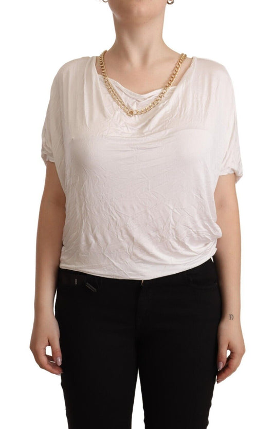Woman wearing white blouse with ruffles on sleeves