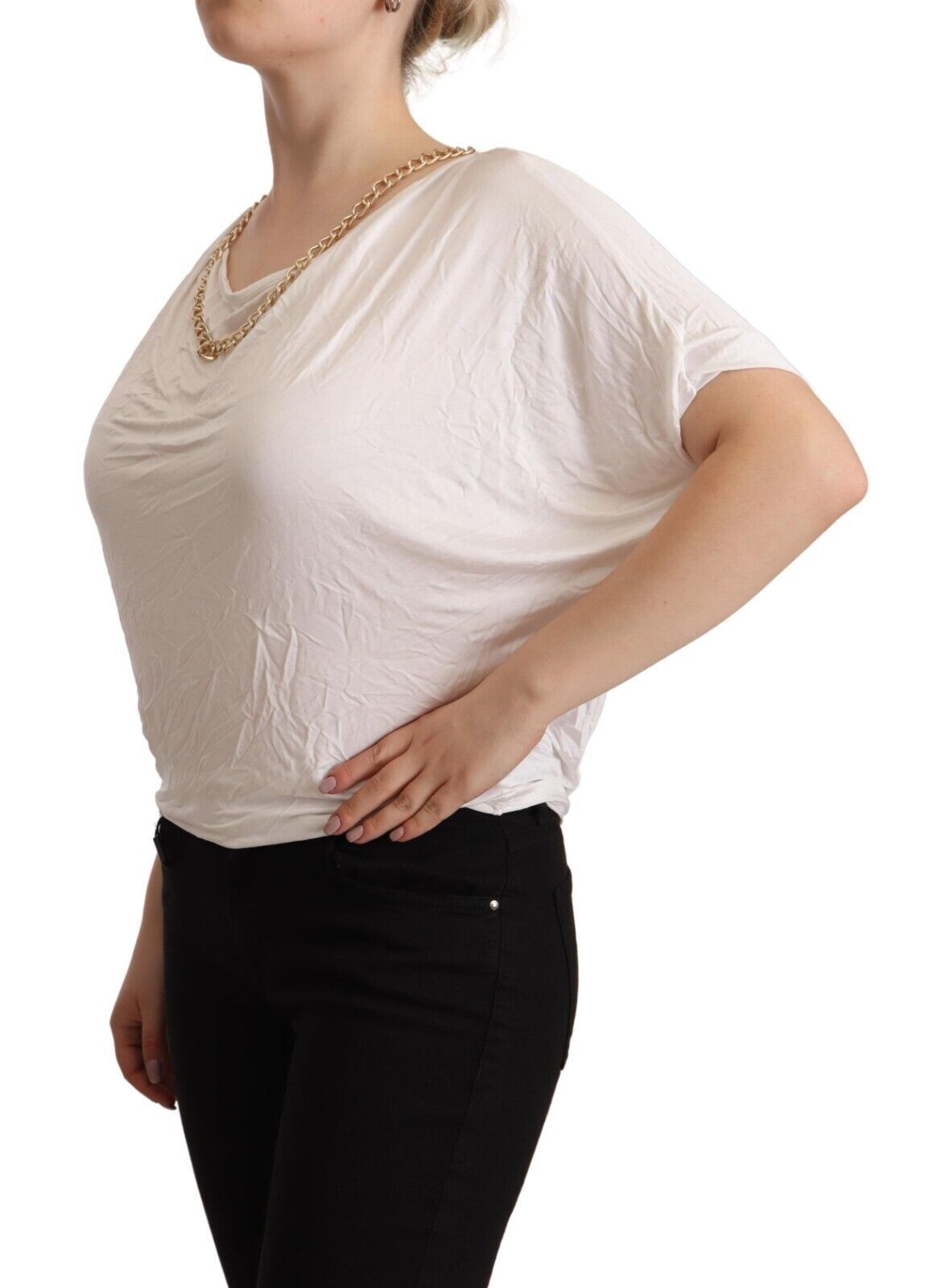 Woman wearing white blouse and black pants